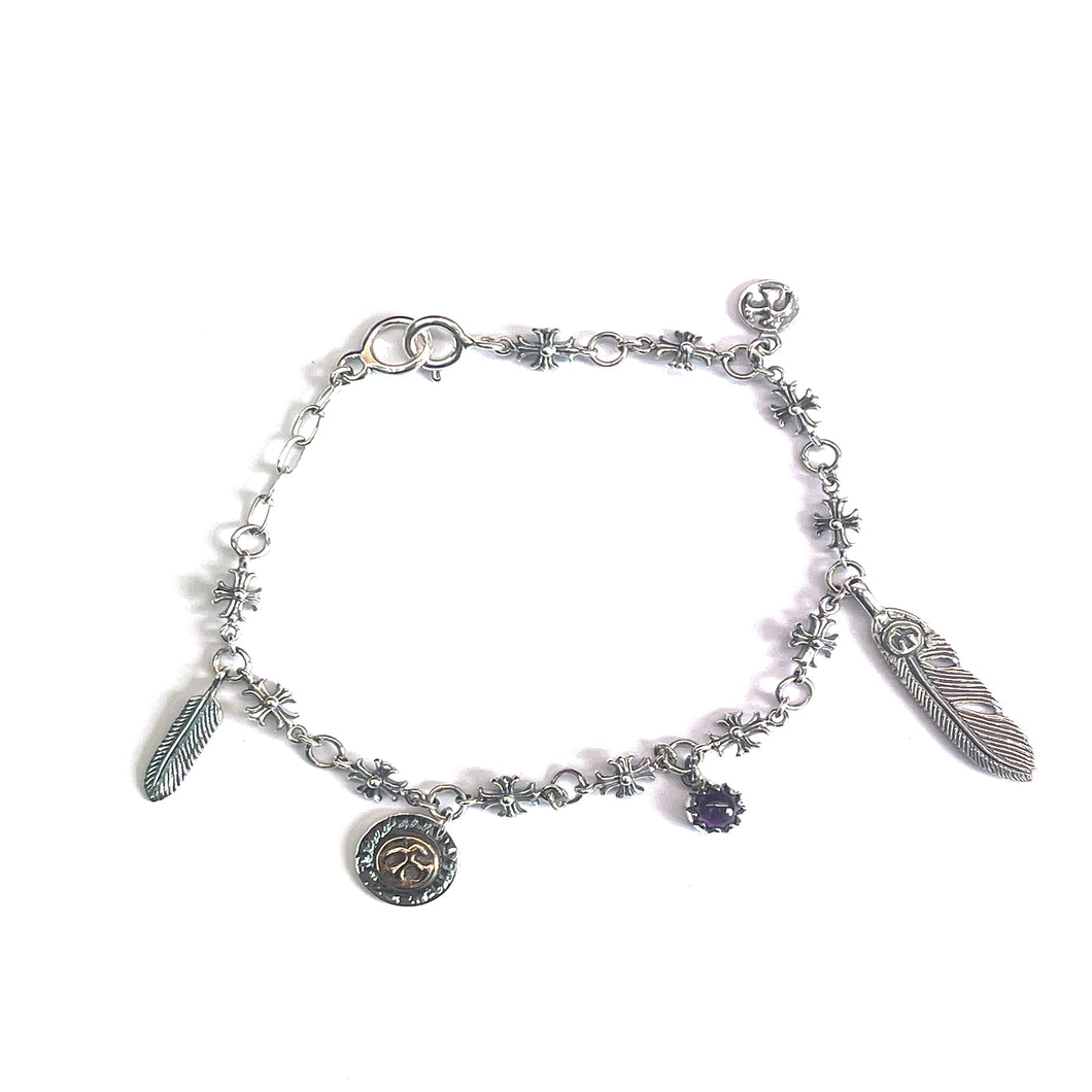 Cross pattern silver bracelet with feather & purple stone