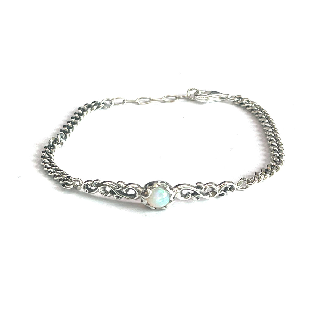Silver bracelet with opal & seagrass pattern