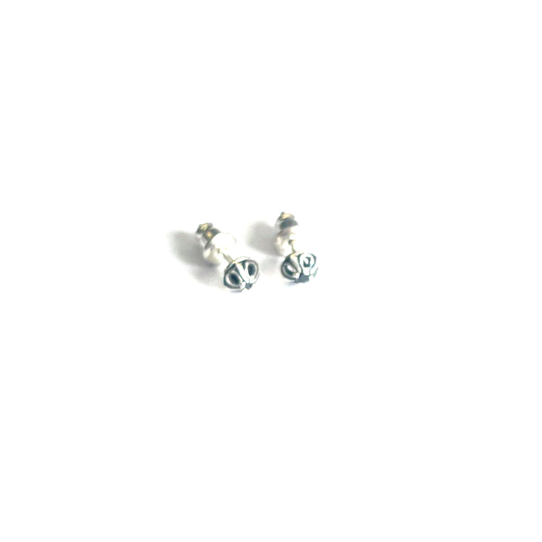 Small silver earring with black stone