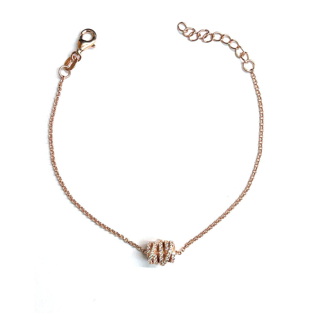 Twist silver bracelet with  white CZ & pink gold plating