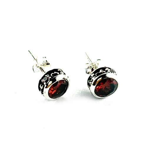 Channel set silver earring with red CZ