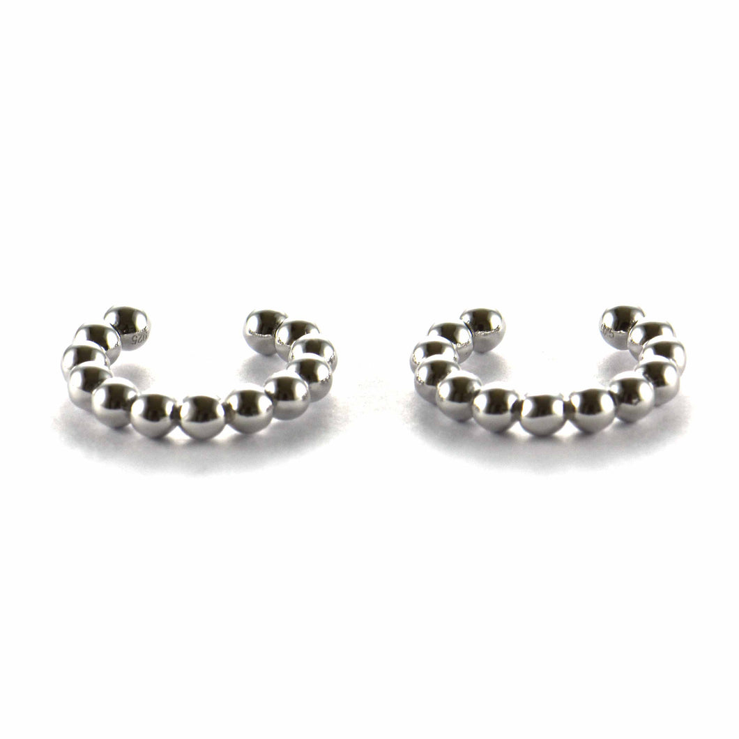 Cuff silver earring with ball pattern