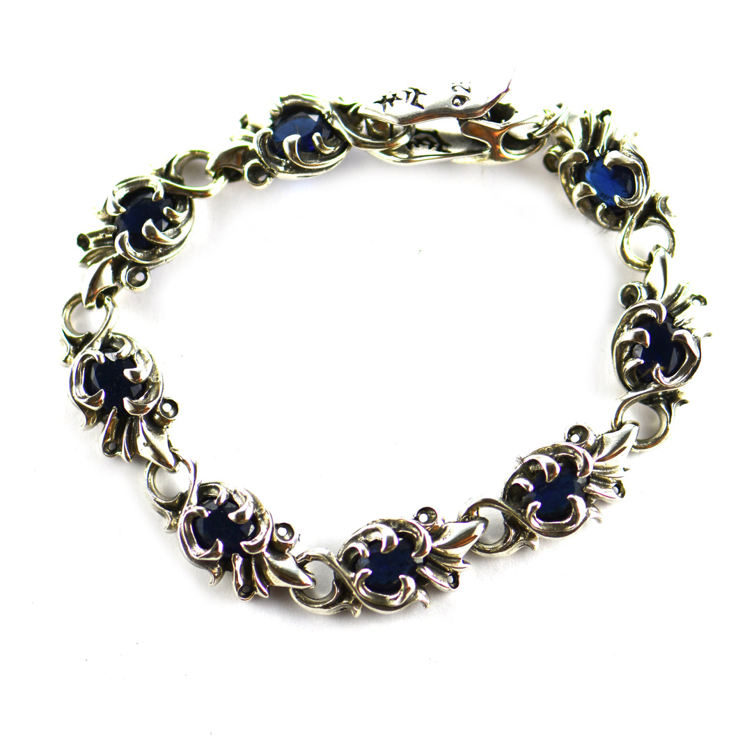 Flower pattern silver bracelet with blue CZ