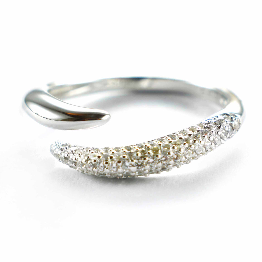 Open silver ring with small white CZ