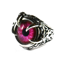 Red eye silver ring with claw setting