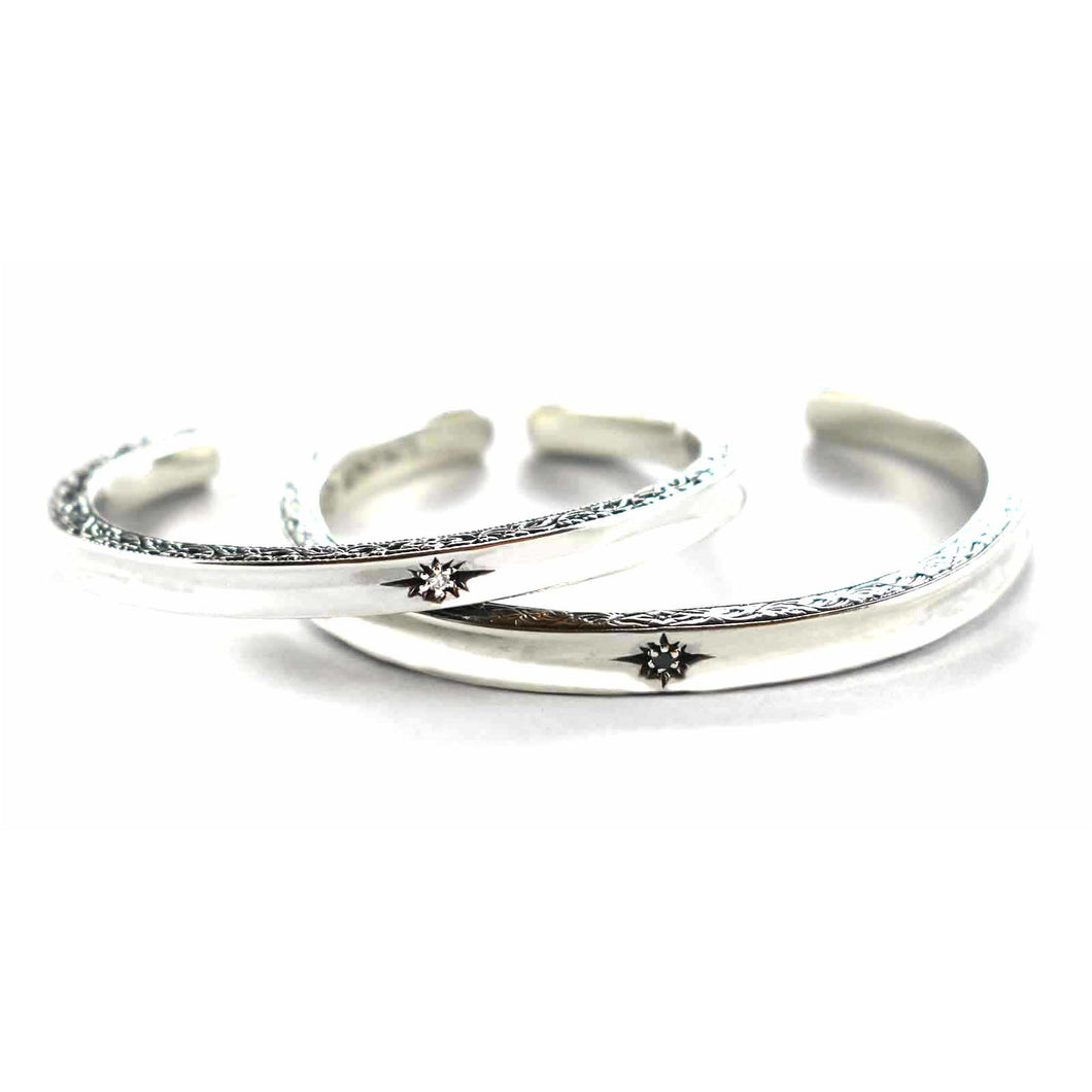 Silver couple bangle with white & black cubic zirconia
