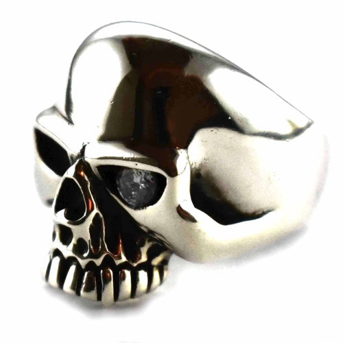 Skull ring with white cubic zirconia in one eye silver ring