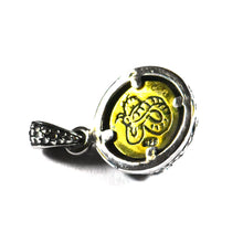 Small red eye silver pendant