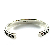 Small skull silver bangle