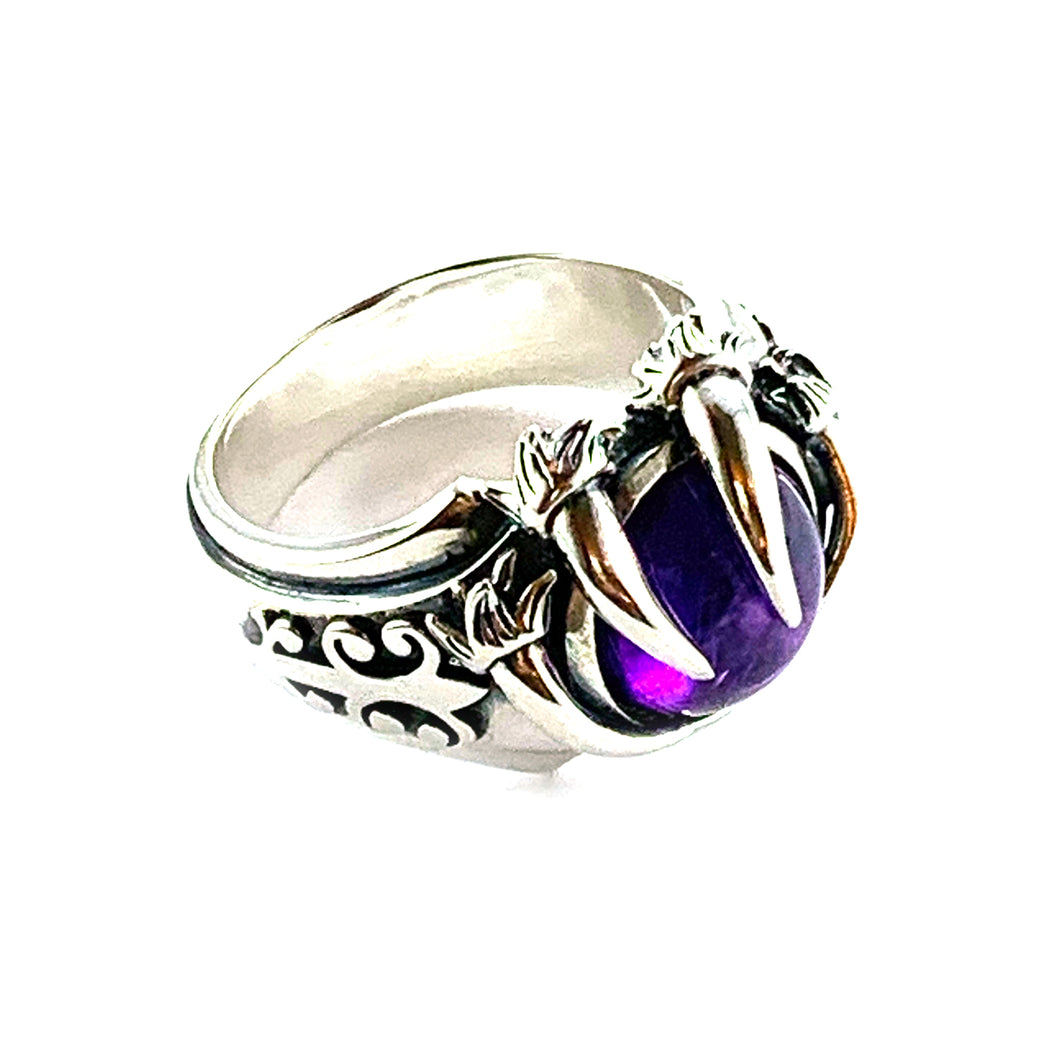 Three claw silver ring with purple stone