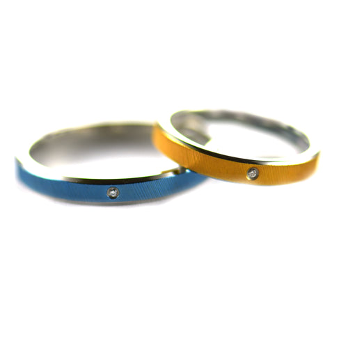 Twill stainless steel couple ring with blue & pink gold plating